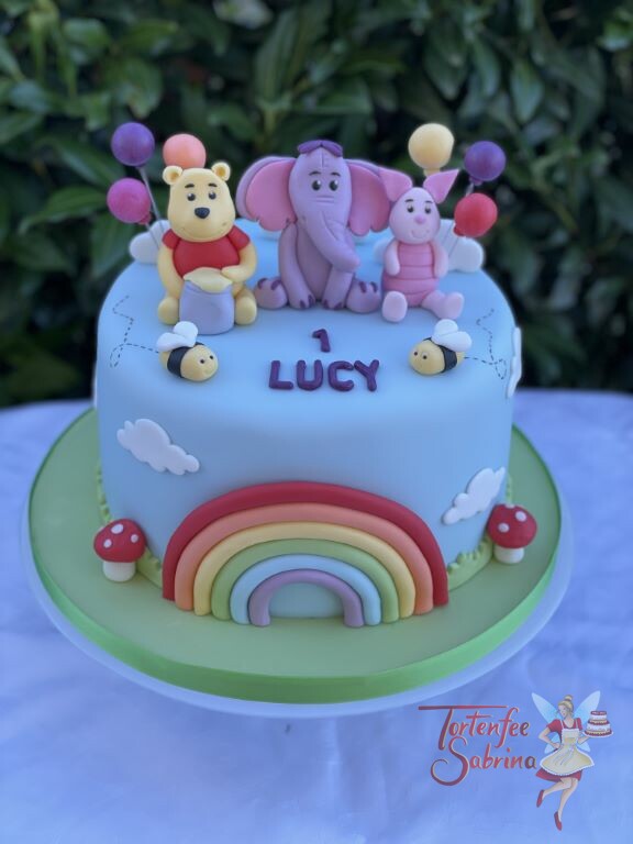 Geburtstagstorte Mädchen - Winnie Pooh und seine Freunde Hefalump und Ferkel sind mit auf der Torte mit dem Regenbogen.