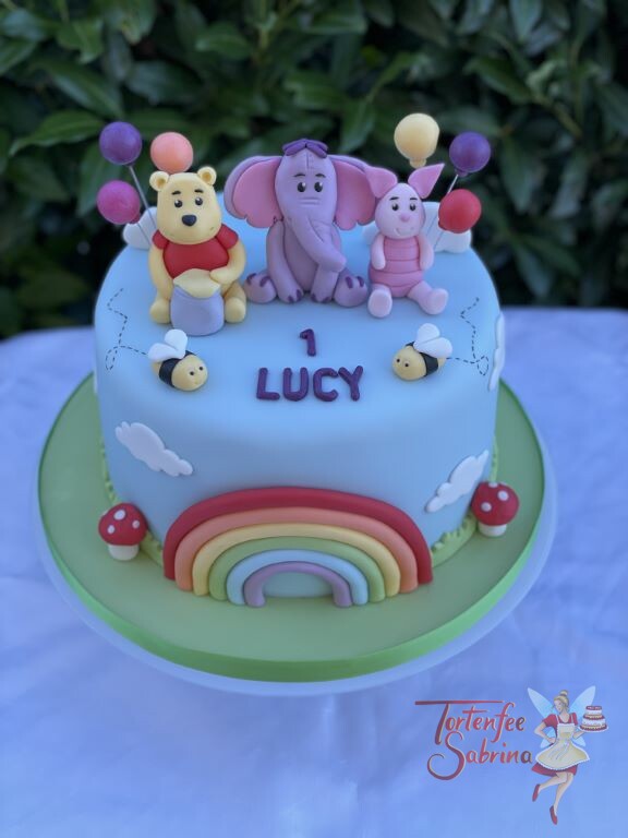 Geburtstagstorte Mädchen - Winnie Pooh und seine Freunde Hefalump und Ferkel sind mit auf der Torte mit dem Regenbogen.