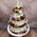 Hochzeitstorte - Früchte und Blumen mal drei, die 3 stöcktige Torte wurde noch mit einem Schokodrip veredelt.