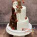 Hochzeitstorte - Kinderriegel mit Herzen auf der Torte, welche zur Hälfte ein Drip Cake ist und auf der anderen Hälfte weiß verziert wurde.