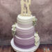 Hochzeitstorte - Von lila bis weiß bilden die färbigen Streifen einen schönen weichen Farbverlauf. Oben ziert die Torte ein Caketopper.