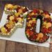 Number Cake - Blumen und Macarons sowie Früchte verzieren die Zahl 70 welche hell und dunkel hergestellt wurde.