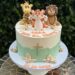 Tauftorte - Der Tiger und seine Freunde, die Giraffe und der Löwe sind ebenfalls oben auf der Torte und freuen sich.