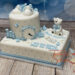 Tauftorte - Niedlicher Eisbär mit Herz sitzt auf der Torte, ebenfalls auf der Torte sind die Geburtsdaten dargestellt.